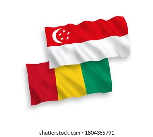 National vector fabric wave flags of Guinea and Singapore isolated on white background. 1 to 2 proportion.