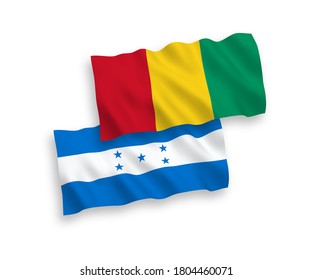 National vector fabric wave flags of Guinea and Honduras isolated on white background. 1 to 2 proportion.