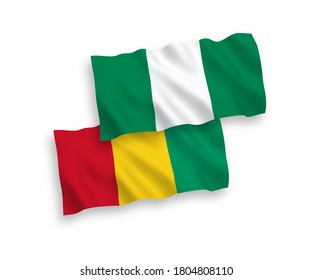 National vector fabric wave flags of Guinea and Nigeria isolated on white background. 1 to 2 proportion.