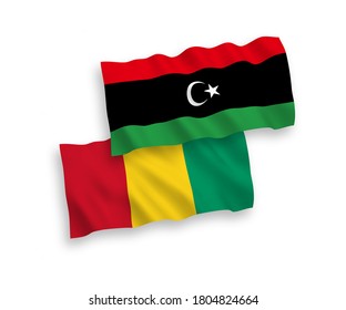 National vector fabric wave flags of Guinea and Libya isolated on white background. 1 to 2 proportion.