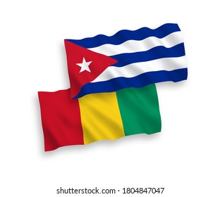 National vector fabric wave flags of Guinea and Cuba isolated on white background. 1 to 2 proportion.