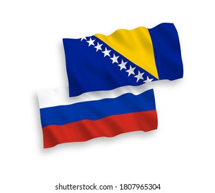 National vector fabric wave flags of Bosnia and Herzegovina and Russia isolated on white background. 1 to 2 proportion.