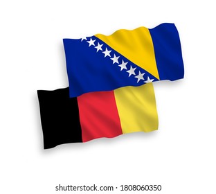 National vector fabric wave flags of Bosnia and Herzegovina and Belgium isolated on white background. 1 to 2 proportion.