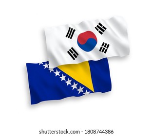 National vector fabric wave flags of South Korea and Bosnia and Herzegovina isolated on white background. 1 to 2 proportion.