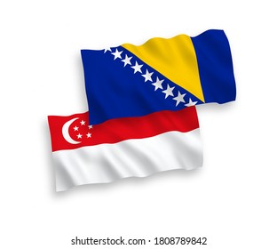 National vector fabric wave flags of Bosnia and Herzegovina and Singapore isolated on white background. 1 to 2 proportion.