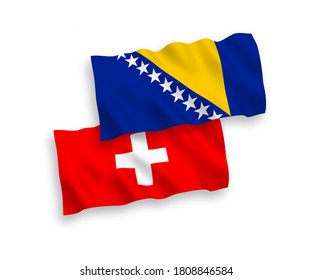 National vector fabric wave flags of Bosnia and Herzegovina and Switzerland isolated on white background. 1 to 2 proportion.