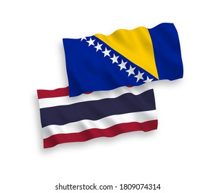 National vector fabric wave flags of Bosnia and Herzegovina and Thailand isolated on white background. 1 to 2 proportion.