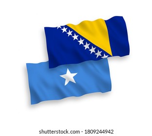 National vector fabric wave flags of Bosnia and Herzegovina and Somalia isolated on white background. 1 to 2 proportion.