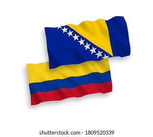 National vector fabric wave flags of Bosnia and Herzegovina and Colombia isolated on white background. 1 to 2 proportion.