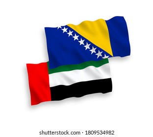 National vector fabric wave flags of Bosnia and Herzegovina and United Arab Emirates isolated on white background. 1 to 2 proportion.