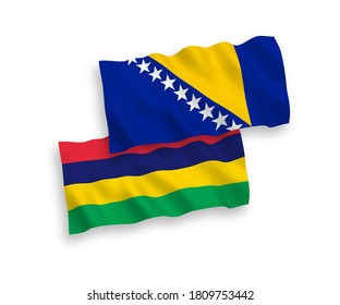 National vector fabric wave flags of Bosnia and Herzegovina and Republic of Mauritius isolated on white background. 1 to 2 proportion.