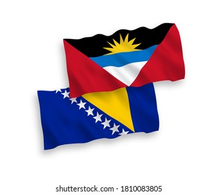 National vector fabric wave flags of Bosnia and Herzegovina and Antigua and Barbuda isolated on white background. 1 to 2 proportion.