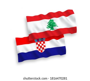 National vector fabric wave flags of Lebanon and Croatia isolated on white background. 1 to 2 proportion.