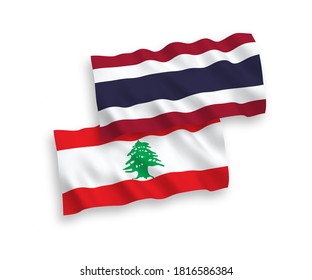 National vector fabric wave flags of Lebanon and Thailand isolated on white background. 1 to 2 proportion.