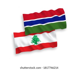 National vector fabric wave flags of Lebanon and Republic of Gambia isolated on white background. 1 to 2 proportion.
