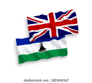 National vector fabric wave flags of Great Britain and Lesotho isolated on white background. 1 to 2 proportion.