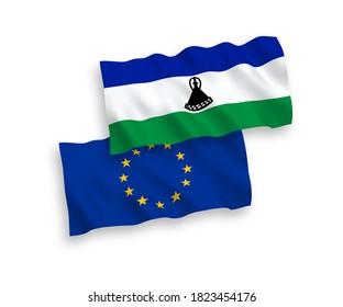 National vector fabric wave flags of European Union and Lesotho isolated on white background. 1 to 2 proportion.