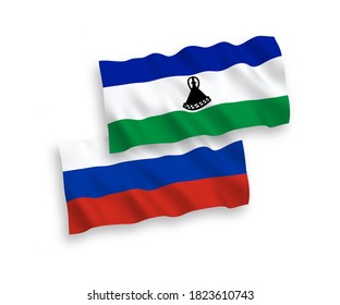 Nationale Vektor-Wellen-Flaggen von Lesotho und Russland einzeln auf weißem Hintergrund. 1 bis 2 %.