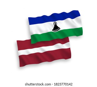 National vector fabric wave flags of Latvia and Lesotho isolated on white background. 1 to 2 proportion.