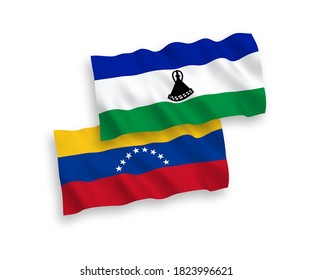 National vector fabric wave flags of Venezuela and Lesotho isolated on white background. 1 to 2 proportion.