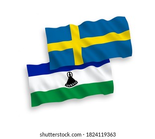 National vector fabric wave flags of Sweden and Lesotho isolated on white background. 1 to 2 proportion.