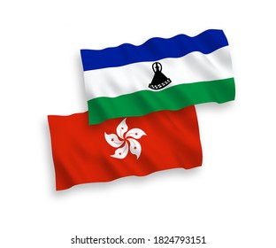 National vector fabric wave flags of Lesotho and Hong Kong isolated on white background. 1 to 2 proportion.