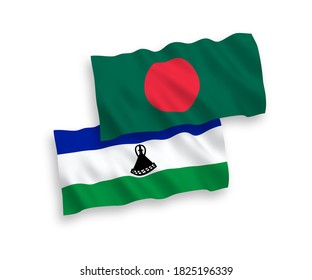 National vector fabric wave flags of Lesotho and Bangladesh isolated on white background. 1 to 2 proportion.