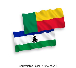 National vector fabric wave flags of Lesotho and Benin isolated on white background. 1 to 2 proportion.