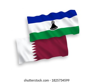 National vector fabric wave flags of Lesotho and Qatar isolated on white background. 1 to 2 proportion.