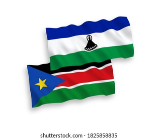 National vector fabric wave flags of Lesotho and Republic of South Sudan isolated on white background. 1 to 2 proportion.