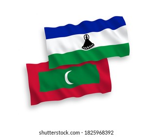 National vector fabric wave flags of Lesotho and Maldives isolated on white background. 1 to 2 proportion.