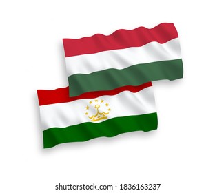National vector fabric wave flags of Tajikistan and Hungary isolated on white background. 1 to 2 proportion.