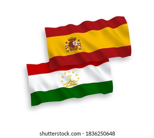 National vector fabric wave flags of Tajikistan and Spain isolated on white background. 1 to 2 proportion.