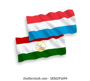 National vector fabric wave flags of Tajikistan and Luxembourg isolated on white background. 1 to 2 proportion.