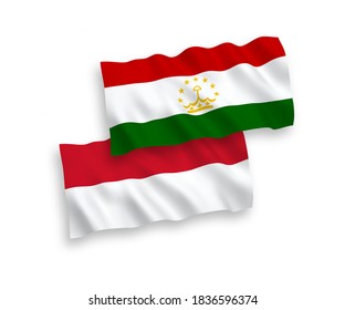National vector fabric wave flags of Indonesia and Tajikistan isolated on white background. 1 to 2 proportion.