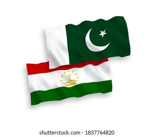 National vector fabric wave flags of Tajikistan and Pakistan isolated on white background. 1 to 2 proportion.