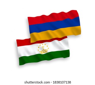 National vector fabric wave flags of Tajikistan and Armenia isolated on white background. 1 to 2 proportion.