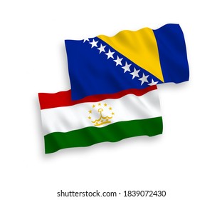 National vector fabric wave flags of Tajikistan and Bosnia and Herzegovina isolated on white background. 1 to 2 proportion.