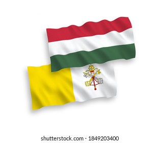 National vector fabric wave flags of Vatican and Hungary isolated on white background. 1 to 2 proportion.