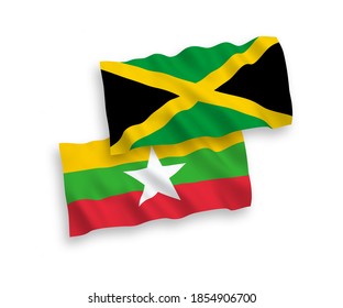 National vector fabric wave flags of Jamaica and Myanmar isolated on white background. 1 to 2 proportion.