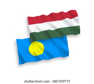 National vector fabric wave flags of Palau and Hungary isolated on white background. 1 to 2 proportion.