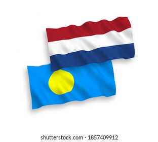National vector fabric wave flags of Palau and Netherlands isolated on white background. 1 to 2 proportion.