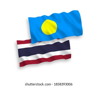 National vector fabric wave flags of Palau and Thailand isolated on white background. 1 to 2 proportion.