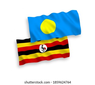 National vector fabric wave flags of Palau and Uganda isolated on white background. 1 to 2 proportion.
