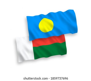 National vector fabric wave flags of Palau and Madagascar isolated on white background. 1 to 2 proportion.