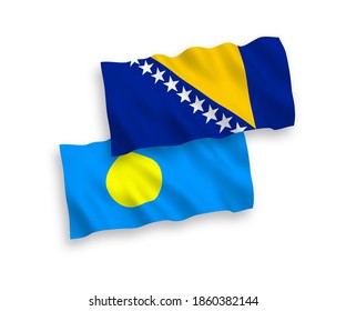 National vector fabric wave flags of Palau and Bosnia and Herzegovina isolated on white background. 1 to 2 proportion.
