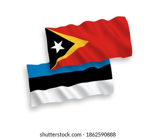National vector fabric wave flags of Estonia and East Timor isolated on white background. 1 to 2 proportion.