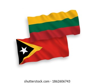 National vector fabric wave flags of Lithuania and East Timor isolated on white background. 1 to 2 proportion.