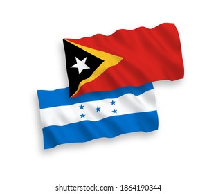 National vector fabric wave flags of East Timor and Honduras isolated on white background. 1 to 2 proportion.