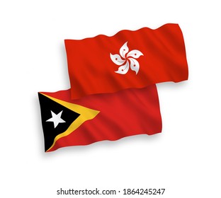 Banderas de olas de tela vectorial nacional de Timor Oriental y Hong Kong aisladas en fondo blanco. de 1 a 2.